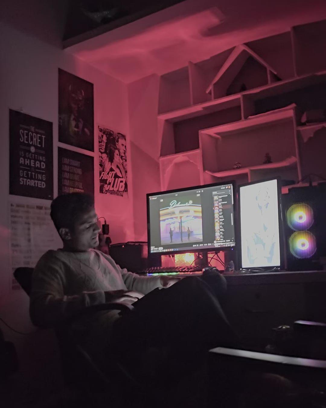 Vishal at his desk in the studio, editing on two monitors